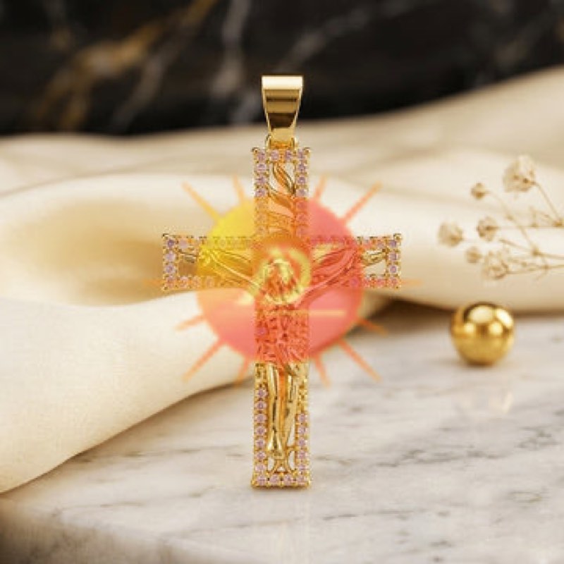 A gold crucifix pendant set with pale stones